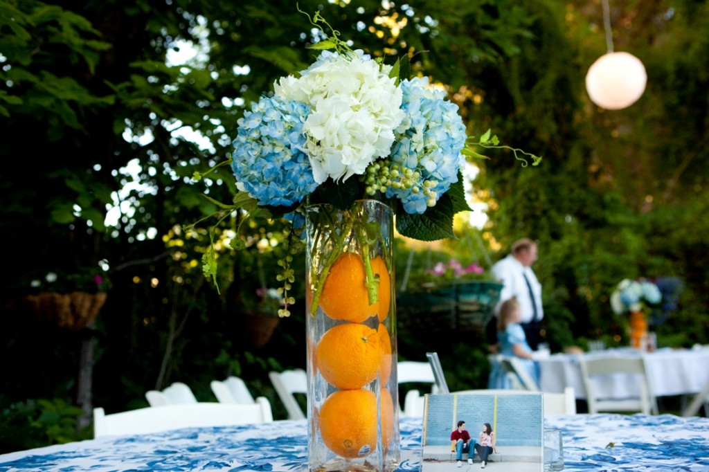 tall wedding centerpiece with fruits,blue and white hydrangea