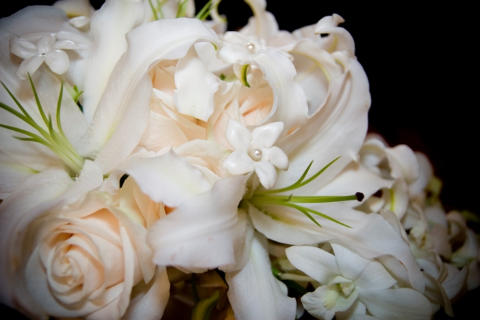 Bridesmaid Bouquets includeOne Dozen offwhite RosesStephanotis and spa 